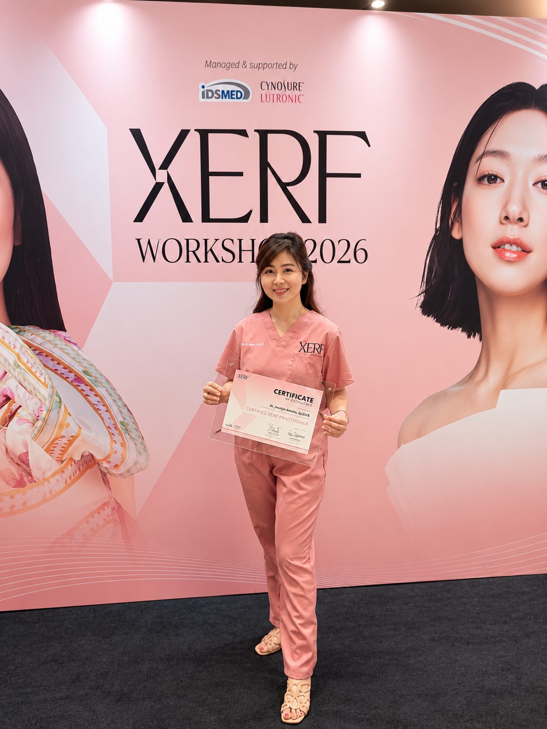 dr. Jesslyn Amelia, Sp.D.V.E holding the Certified XERF Practitioner certificate of excellence at XERF Workshop 2026